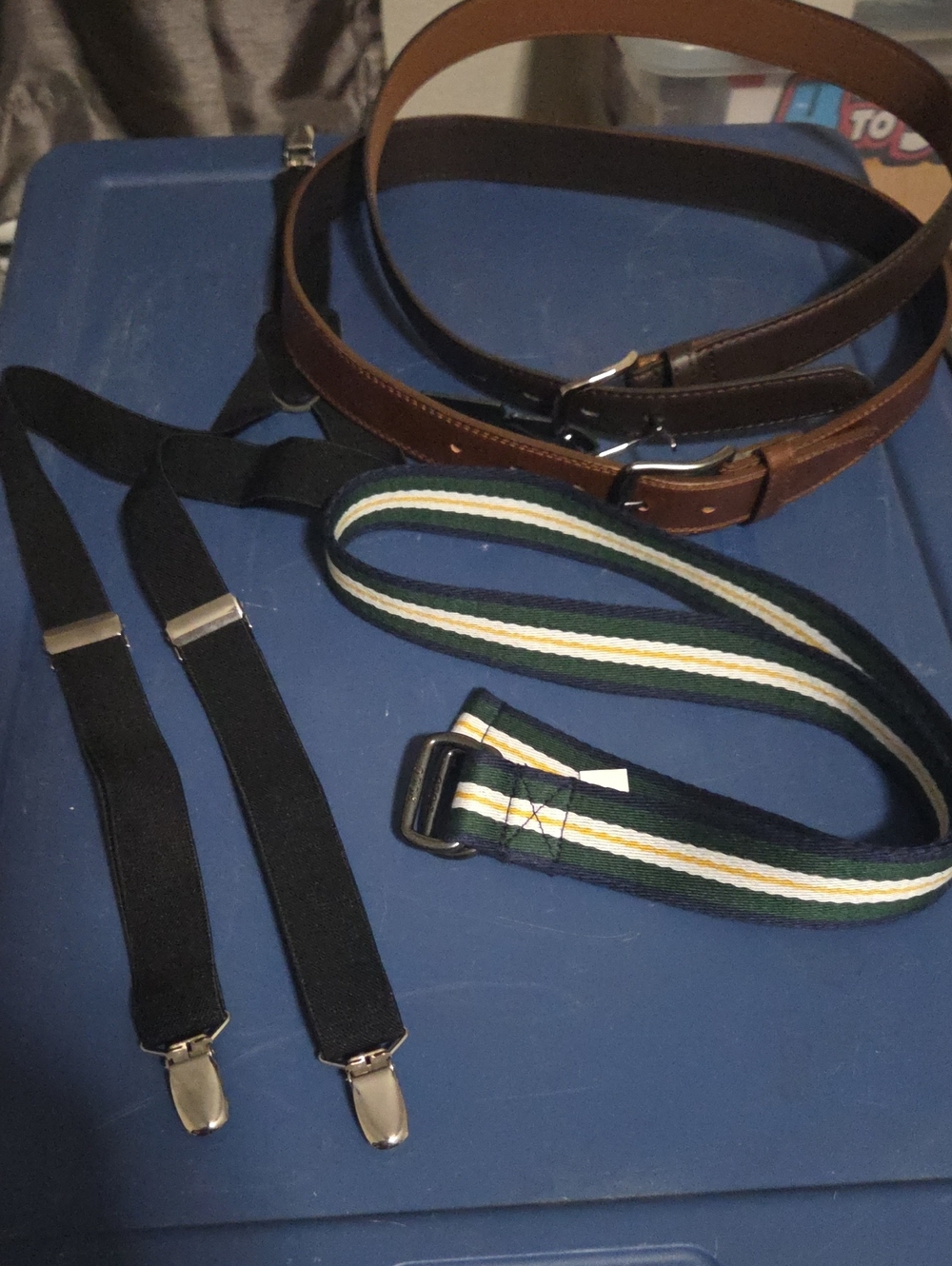 3 Belts.  2 Brown Boys Belts, A Canvas Polo Belt And Black Suspenders.